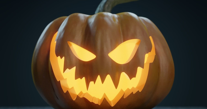 Black background with orange jack-o-lantern, evil smile with teeth. Glowing light orange with a candle.