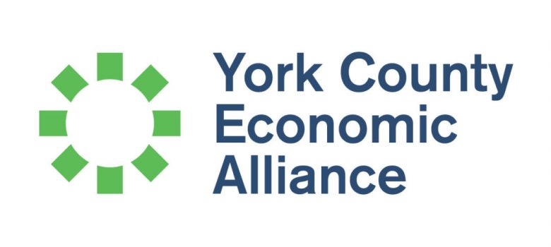 Green squares forming a circle on then left side. Blue text to the right of the circle, "York County Economic Alliance"