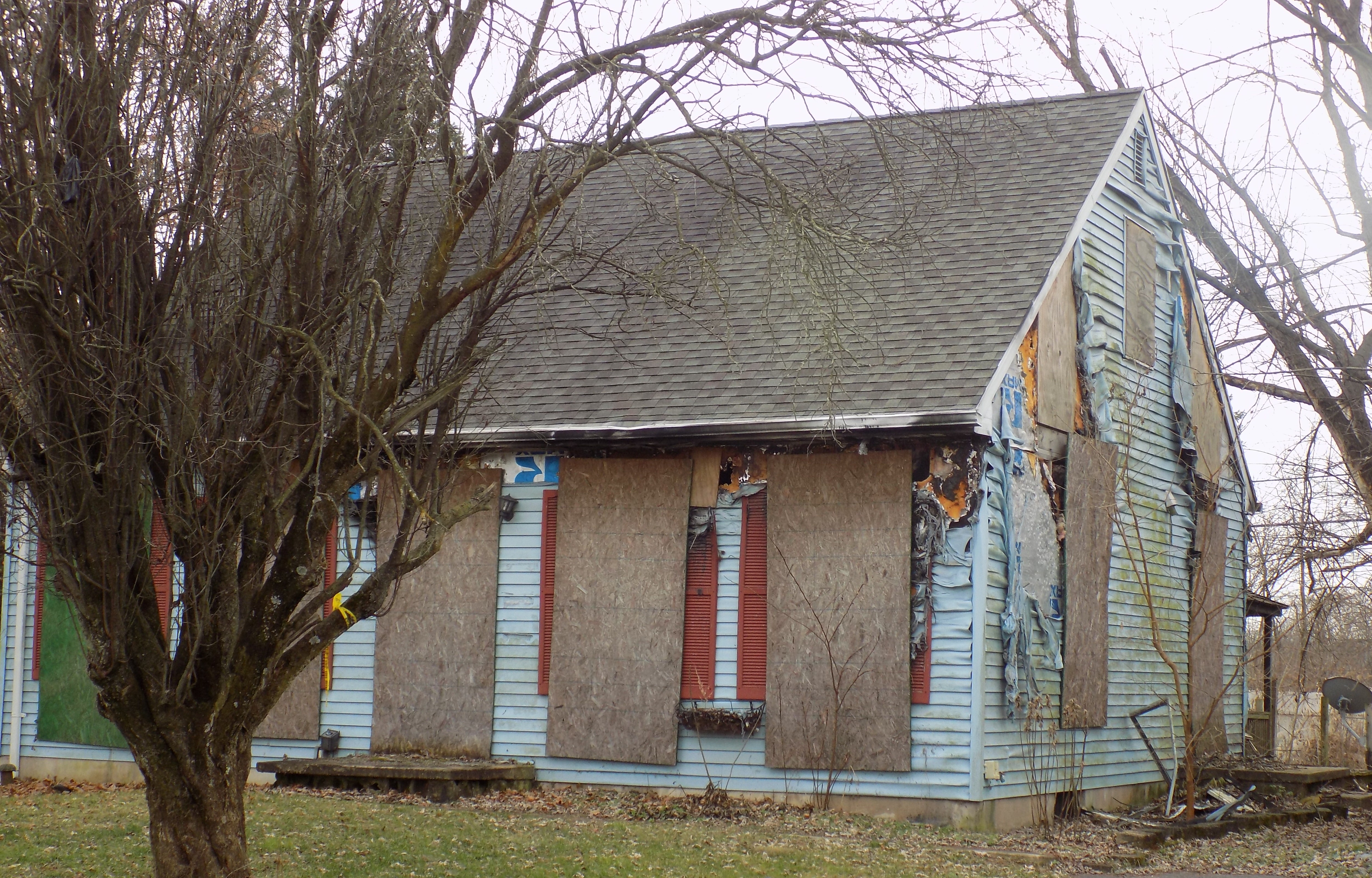 Picture of a blighted house abandoned after fire damage.